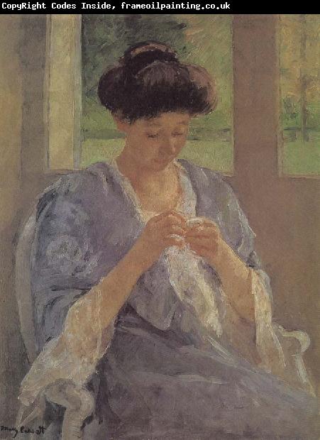 Mary Cassatt lady is sewing in front of the window